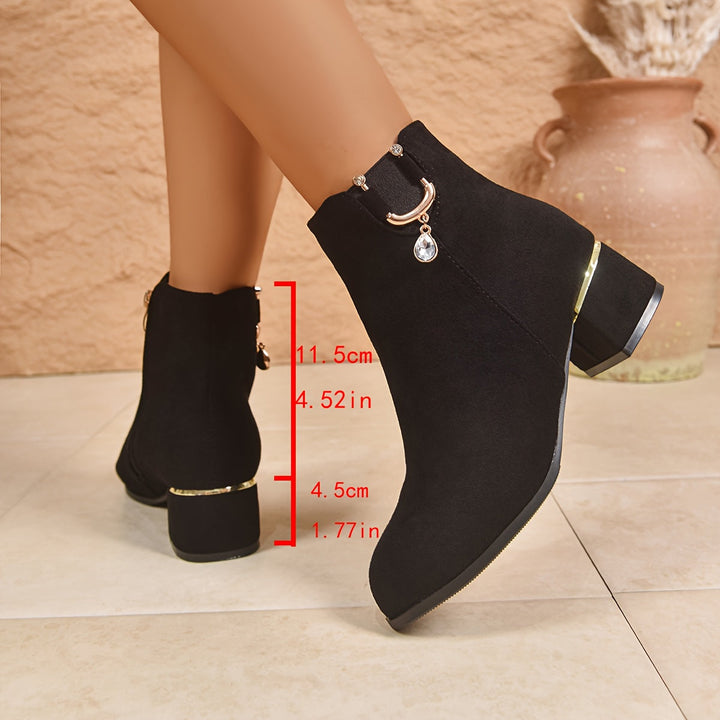 Elegant brown women's Chelsea boots with a modern block heel, ideal for casual and stylish fall outfits.