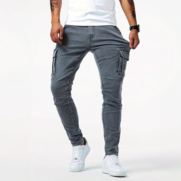 Blue men's slim fit cargo pants with stretch comfort. Stylish, modern utility bottoms for casual fashion.