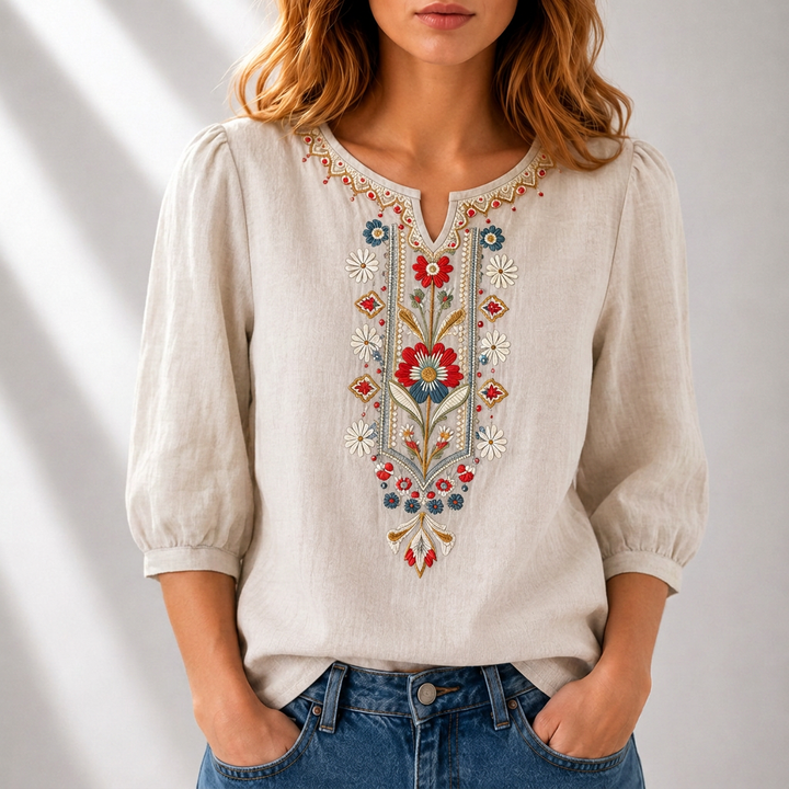 Boho women's blouse with delicate floral embroidery & split neck. Effortless chic for spring fashion.