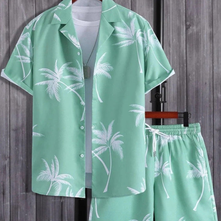 Fashionable men's two-piece tropical summer outfit, a complete resort wear set with printed shirt & shorts.