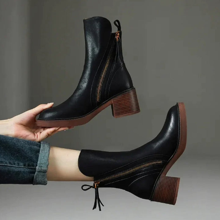 Chic women's fashion ankle boots featuring a sturdy block heel and convenient side-zip for easy wear.