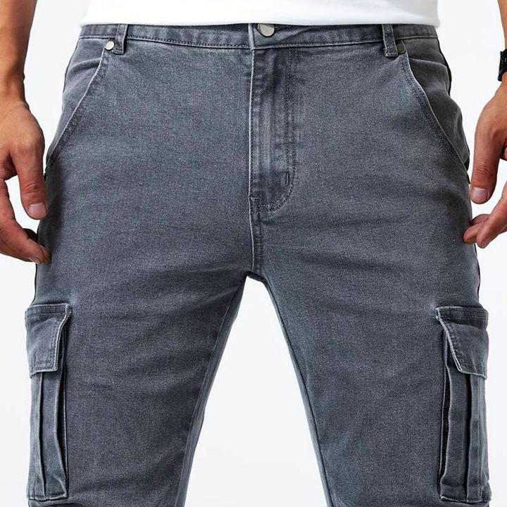 Comfortable men's stretch denim cargo pants with multiple utility pockets for active urban life.
