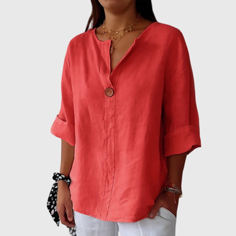 Comfortable women's long-sleeve V-neck blouse with a single button, an elegant and versatile top for any occasion.