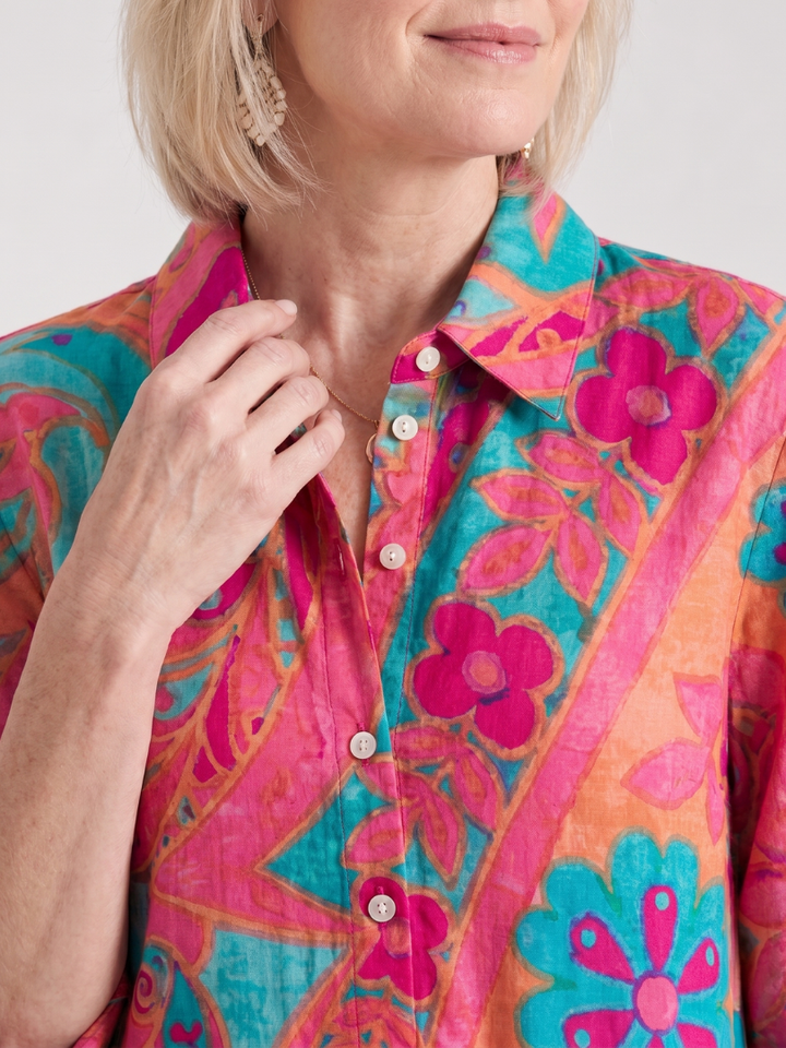 Printed button-front collared midi dress for women, featuring short sleeves. A fashionable and comfortable summer outfit.