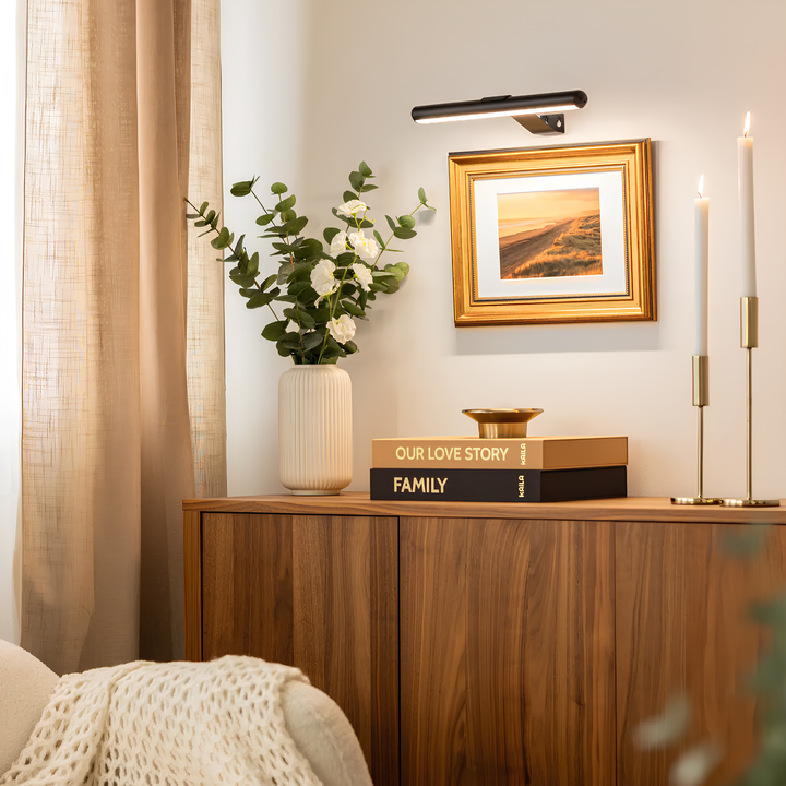 Dimmable LED wall light, rechargeable, provides adjustable lighting for artwork & photos.