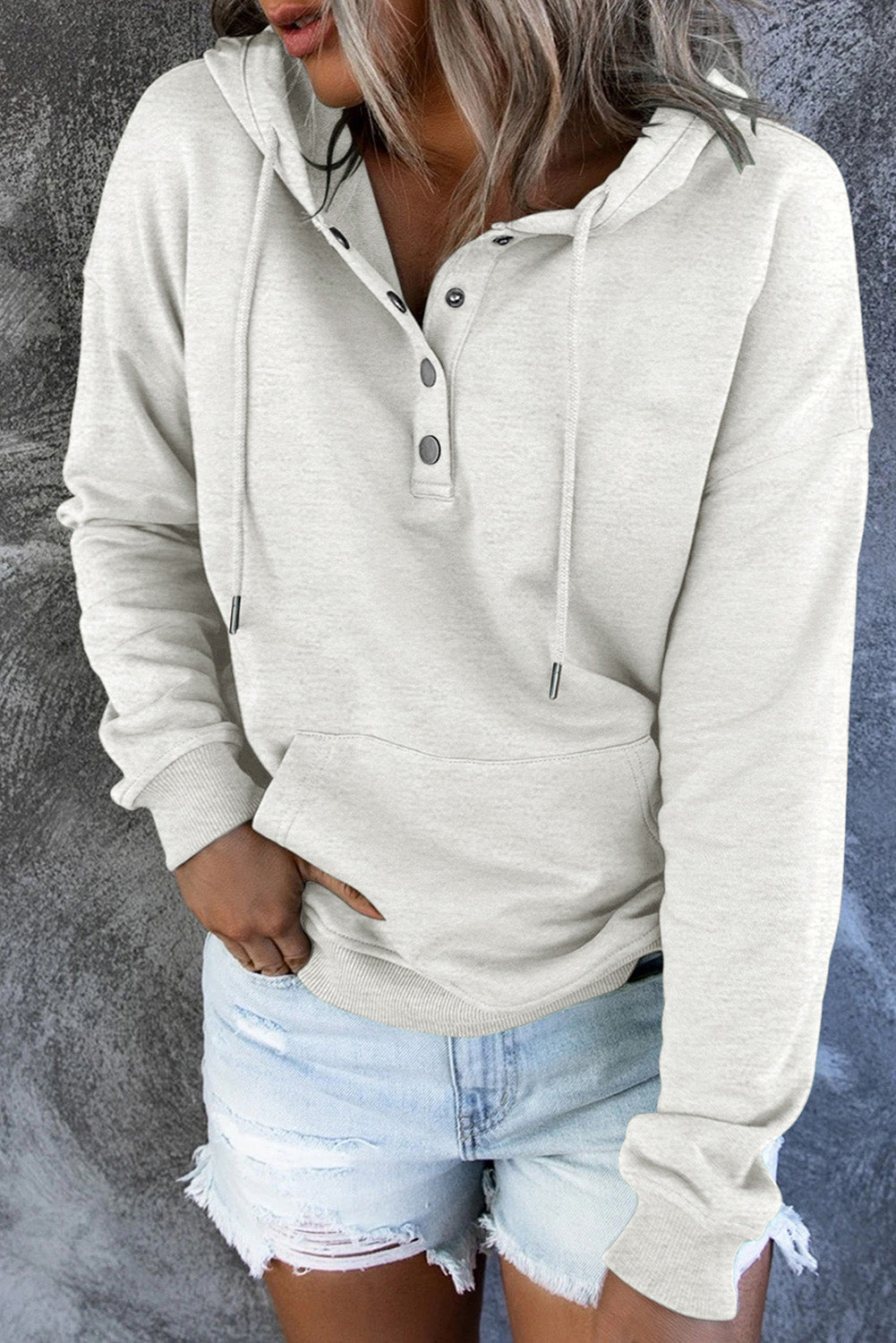 Minimalist women's hooded sweater, comfortable and effortlessly stylish everyday apparel.