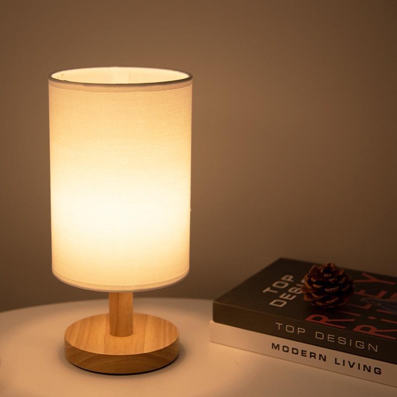 Dimmable LED table lamp with wood base & fabric shade. Modern minimalist design for natural decor.