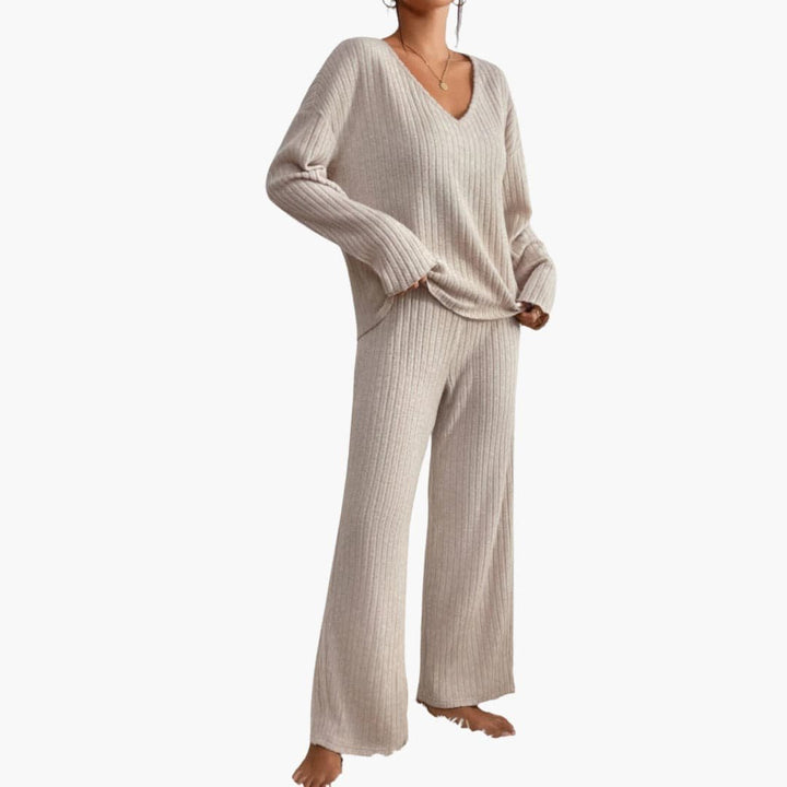 Elegant women's ribbed loungewear set with long sleeve top & straight leg pants for relaxed comfort.