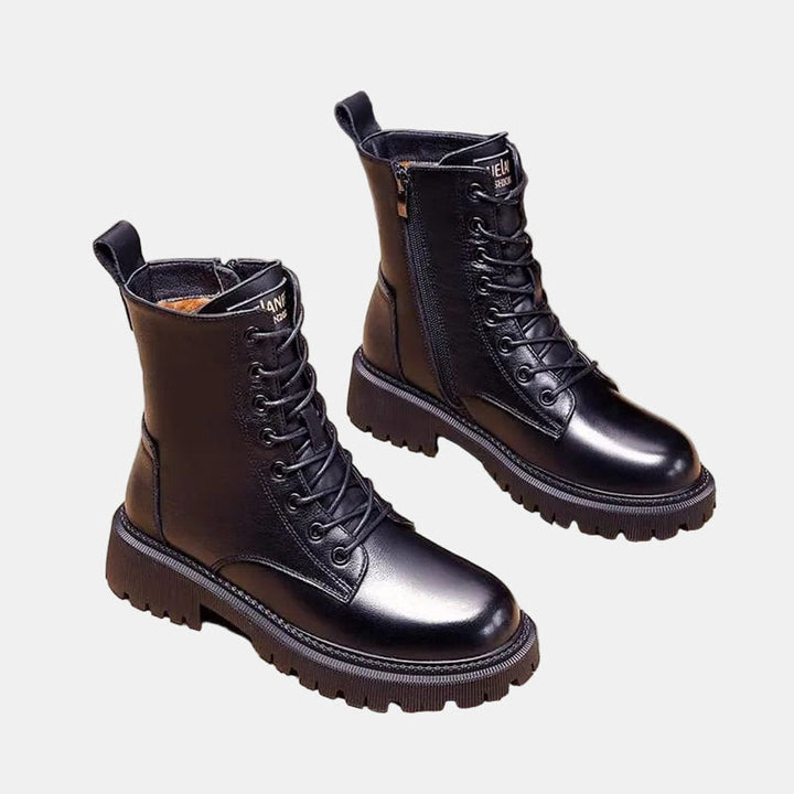 Casual women's lace-up ankle combat boots, ideal for stylish winter outfits & everyday comfort. Durable lug sole.