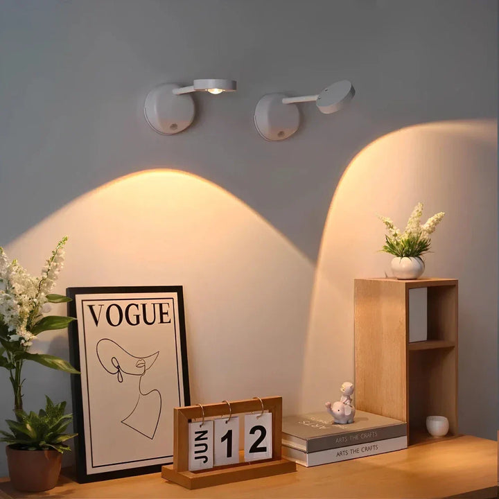 Adjustable wireless LED motion spotlight, modern design & dimmable. Enhances contemporary home decor.
