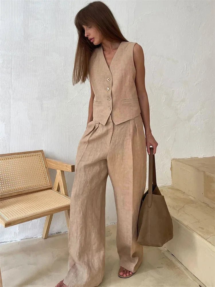 Close-up of the elegant pleats on the wide-leg trousers from the women's two-piece set.