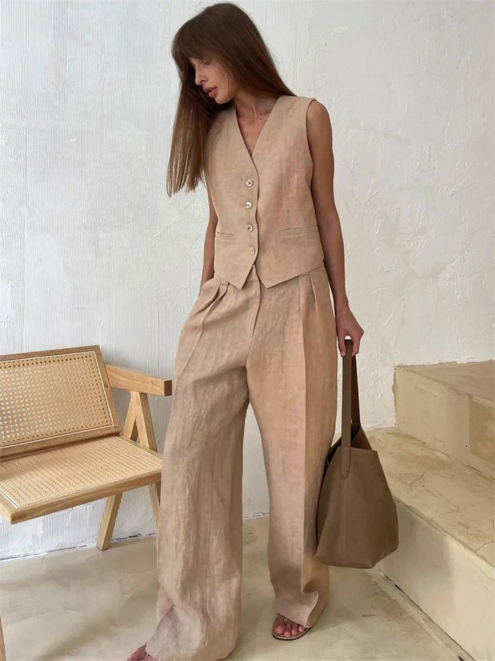 Close-up of the elegant pleats on the wide-leg trousers from the women's two-piece set.