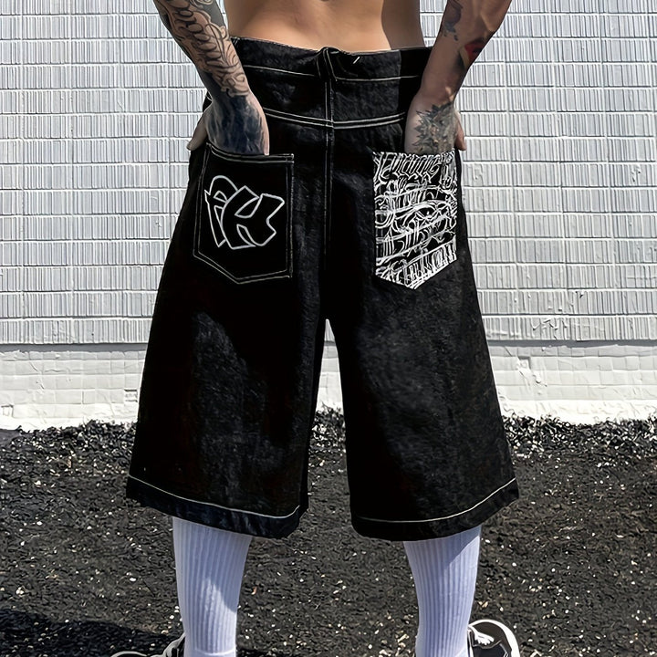 Men's knee-length denim shorts, loose fit, accented with intricate floral embroidery details.