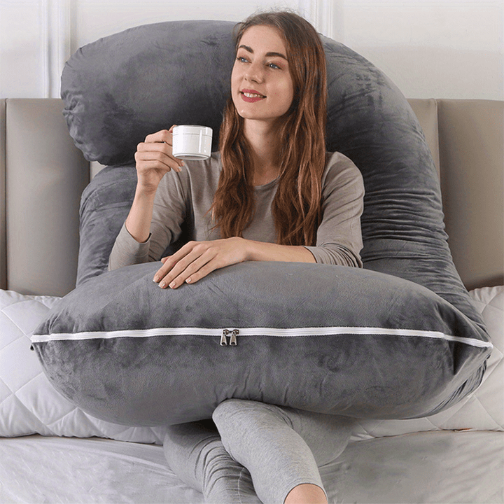 Women's full body maternity pillow for pregnancy support & comfort, an essential sleeping aid.