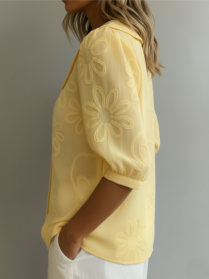 Casual women's short sleeve floral embroidered blouse with a relaxed fit. Stylish round neck top for versatile everyday elegance.