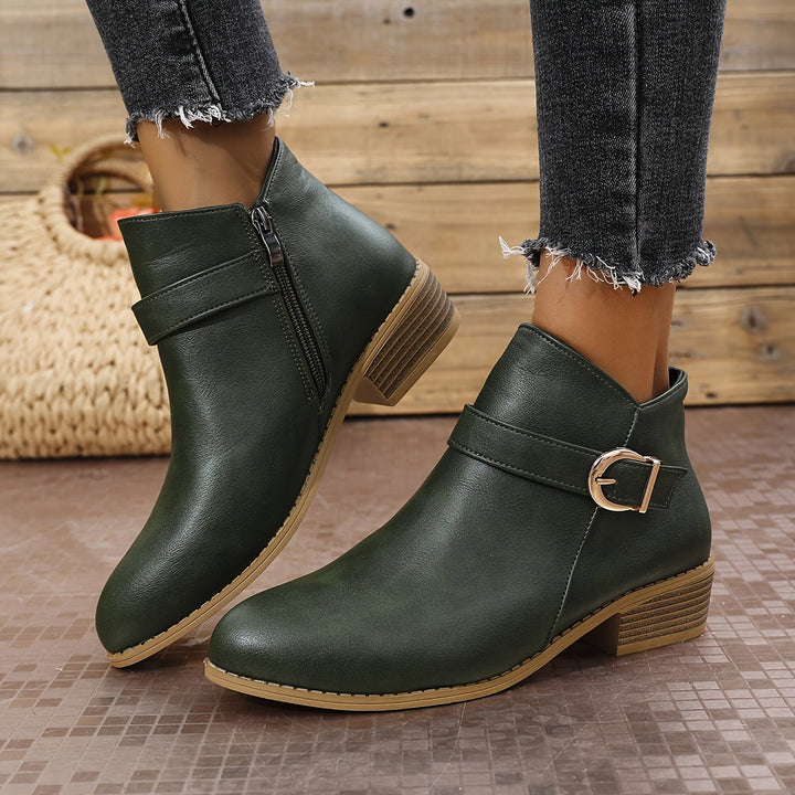Chic green Chelsea ankle boots for women, showcasing a modern buckle detail, ideal for everyday fashion.
