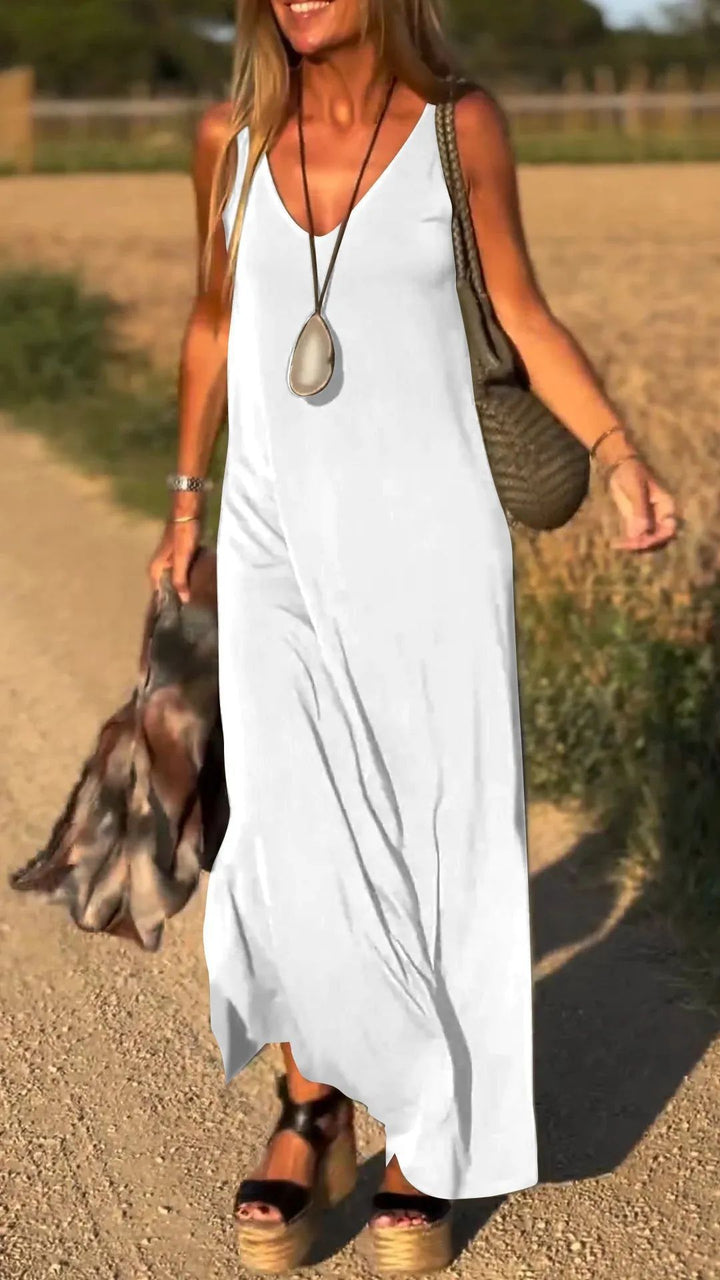 Women's summer fashion sleeveless maxi dress. Elegant long flowy design with wide waist.