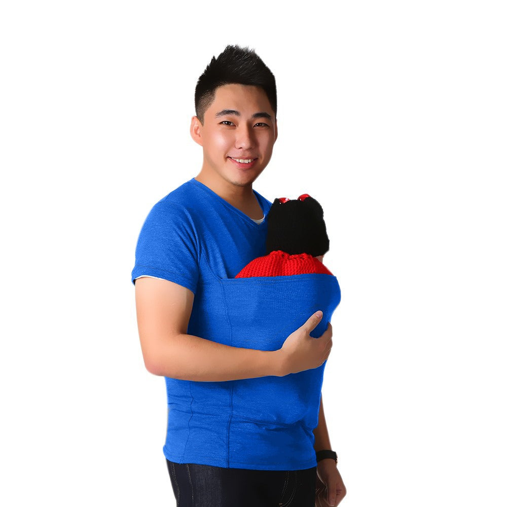 Mom smiling while wearing a versatile babywearing T-shirt, cuddling her infant close in this comfy carrier top.