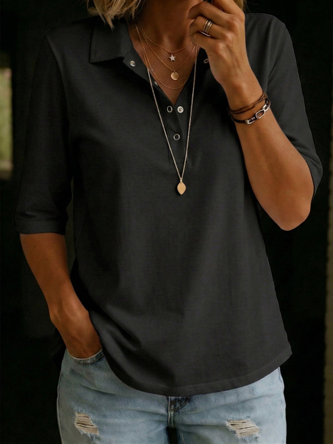 Soft knit women's sweater with a flattering V-neckline and three-quarter sleeves for easy style.