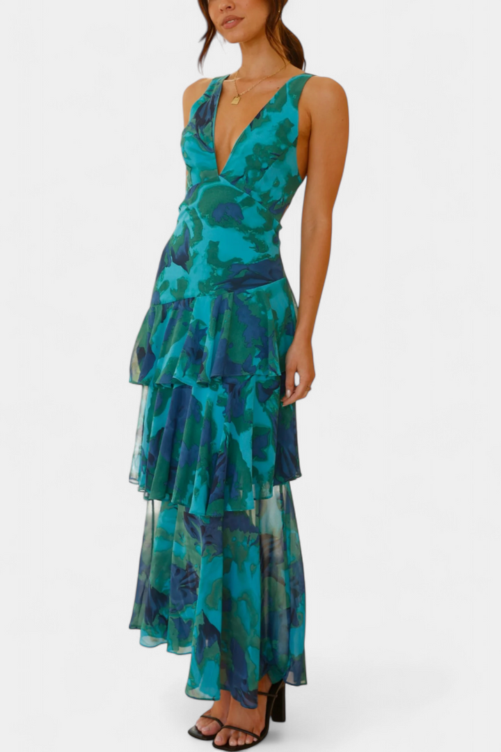 Flowy tiered ruffle maxi dress with plunging V-neck, perfect for elegant formal wear.