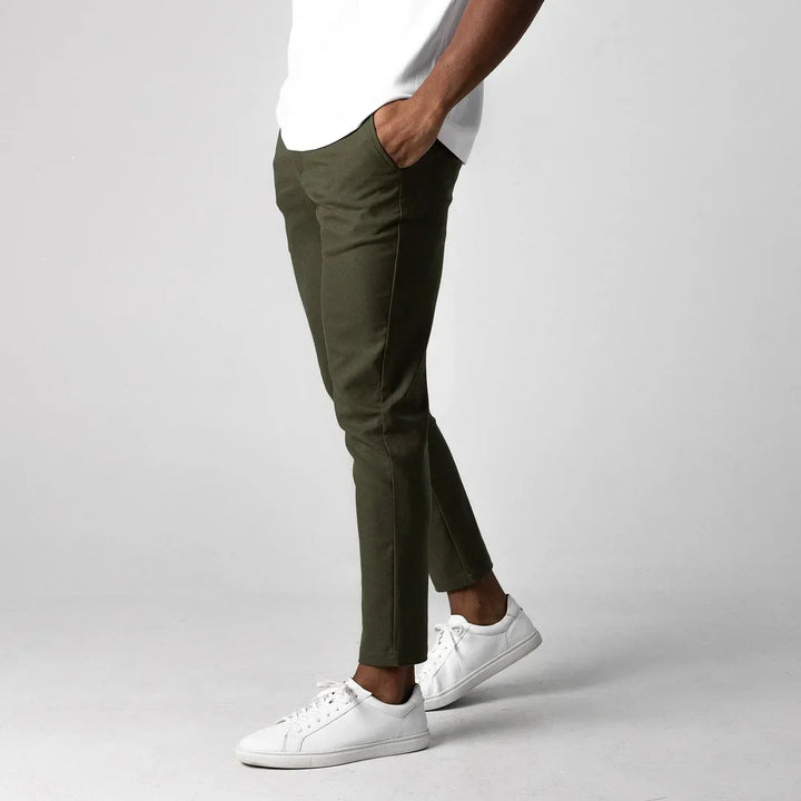 Man in grey stretch chinos, ideal for active wear and modern men's fashion.