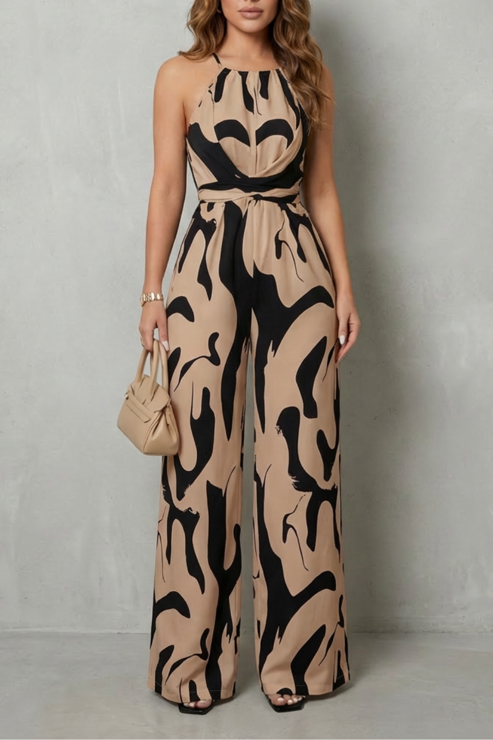 Women's elegant abstract print halter wide-leg jumpsuit, a comfortable and chic option for summer style.
