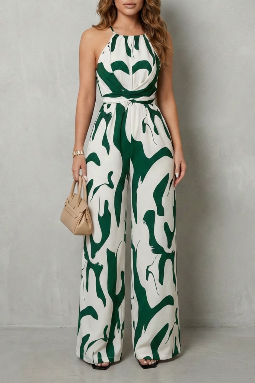 Fashionable women's halter wide-leg jumpsuit featuring an eye-catching abstract print, suitable for any event.