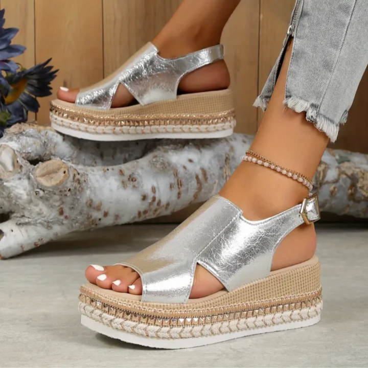 Statement women's platform sandals: espadrille sole, metallic finish, comfortable ankle strap.