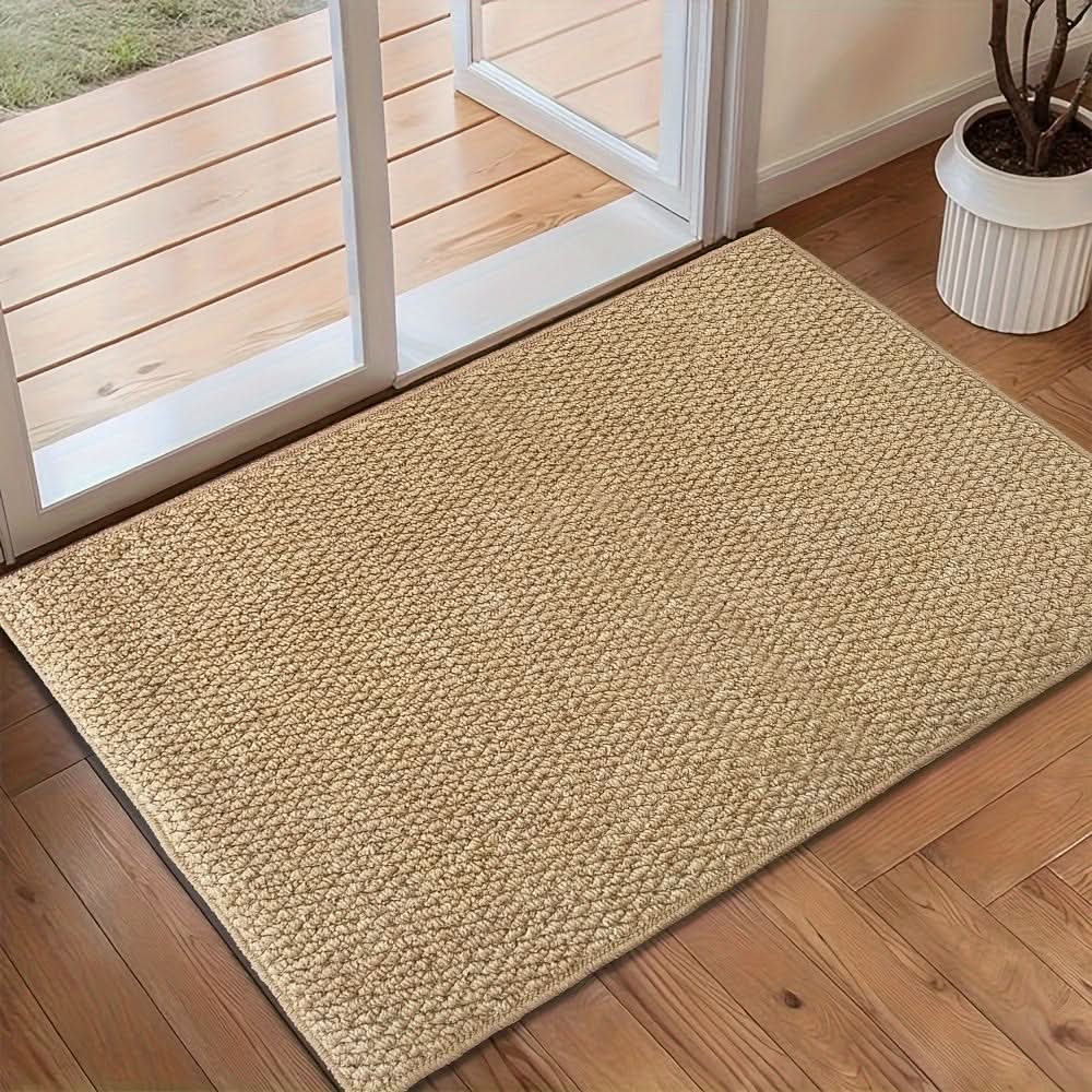 Stylish absorbent door mat for indoor entryway, protecting floors from dirt & moisture.