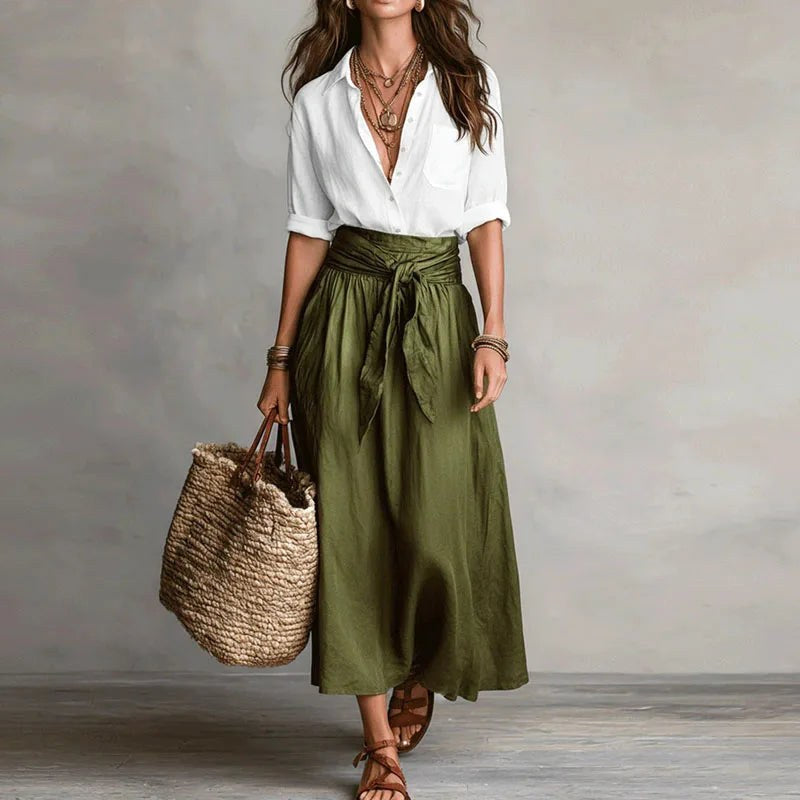 Comfortable women's two-piece linen outfit with relaxed fit top and matching pants, ideal for summer.