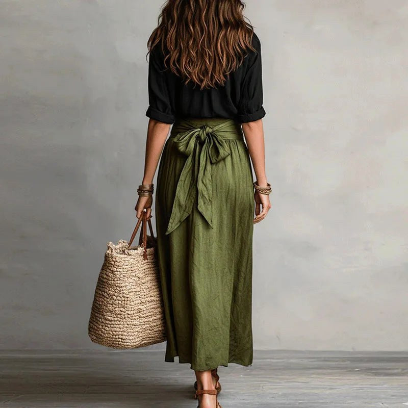 Model in a women's linen two-piece summer set, showcasing comfortable and breathable holiday fashion.