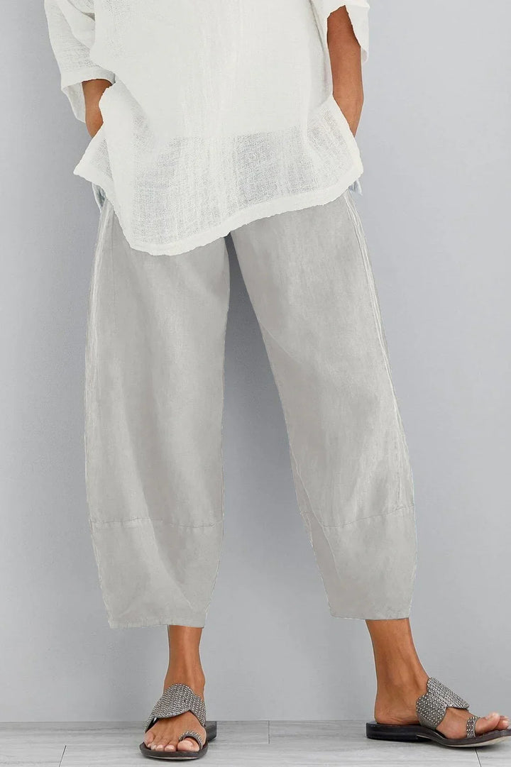 Effortlessly chic women's wide leg cropped trousers with pockets. Stylish and comfortable casual wear for any occasion.