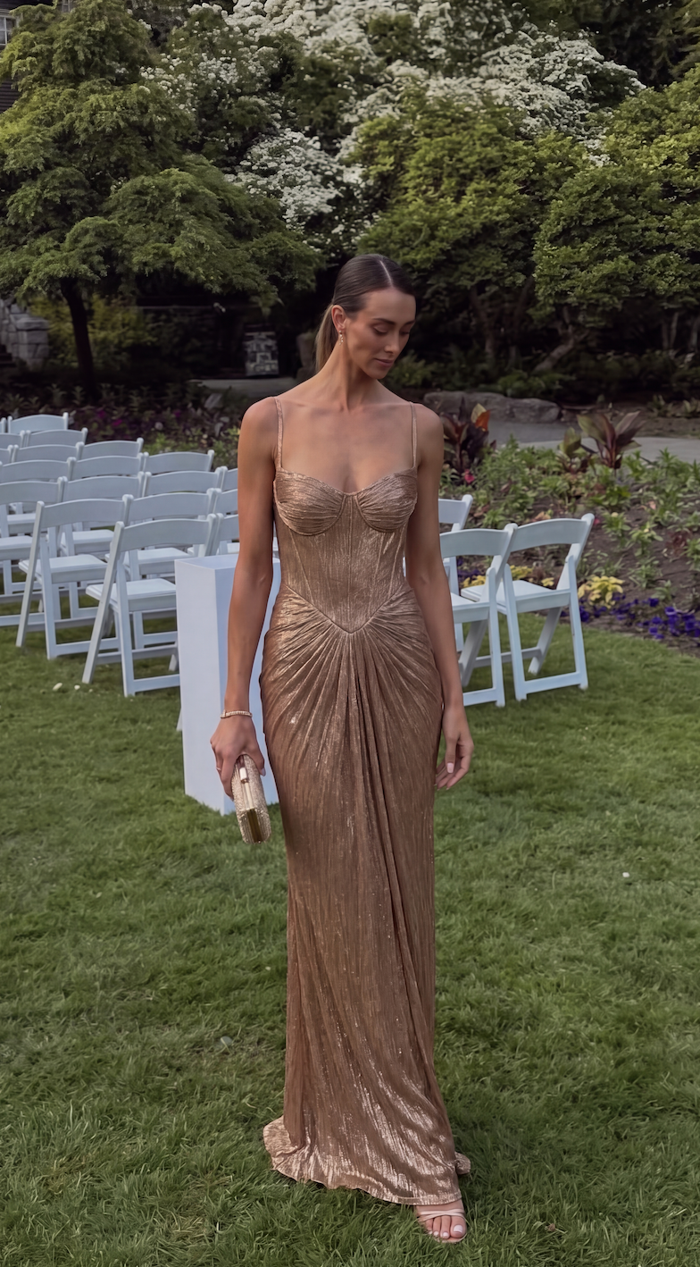 Glamorous shimmer maxi dress featuring a ruched bodice & elegant long skirt for formal evening wear.