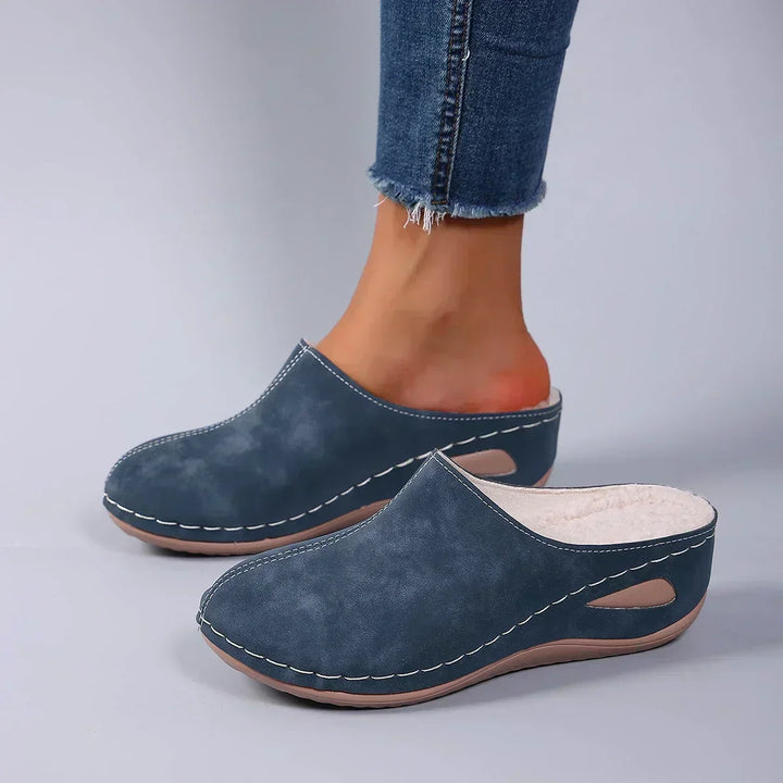 Cozy women's warm indoor slip-on slippers, cushioned for ultimate home comfort and support.