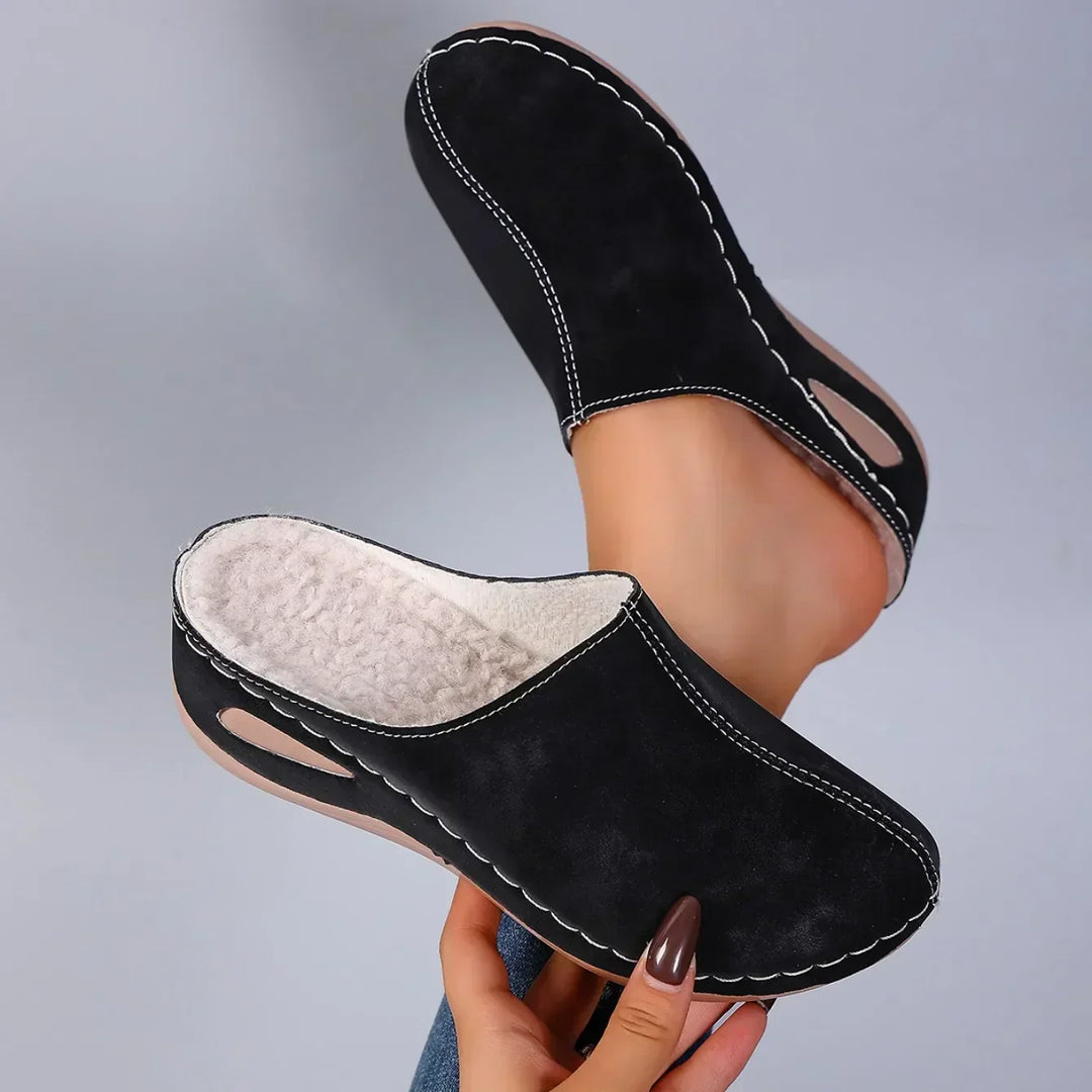 Stylish women's slip-on house shoes, cushioned and supportive for indoor comfort and foot relief.