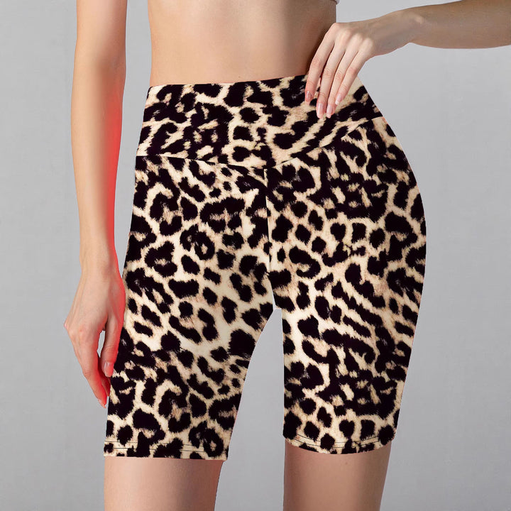 Shiny high-waisted women's bike shorts. Versatile athletic activewear for gym, yoga, and stylish daily wear.