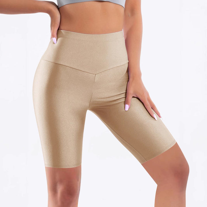 Fashionable women's shiny high-waisted bike shorts. Excellent sportswear for yoga, gym, and athletic comfort.