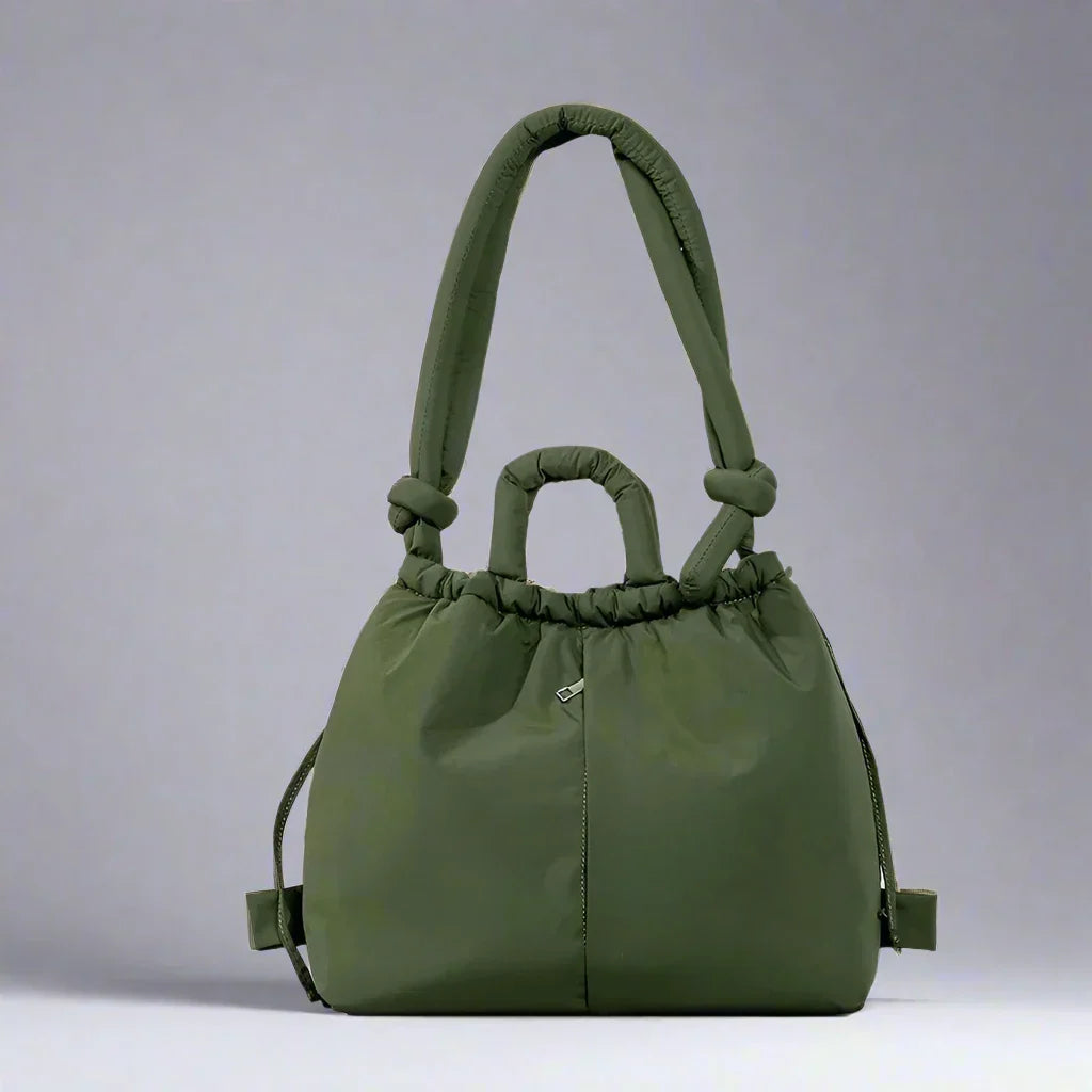 Lifestyle shot of someone using the beige quilted puffer tote bag