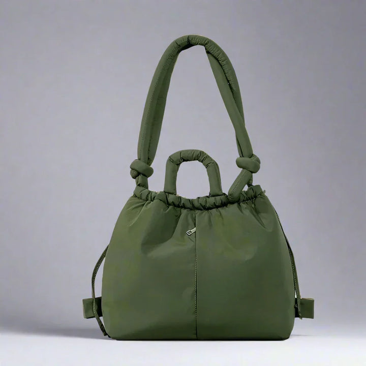 Lifestyle shot of someone using the beige quilted puffer tote bag