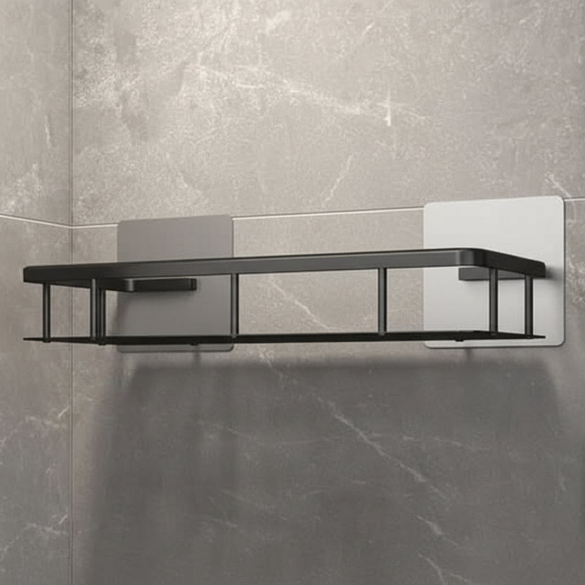 Modern drill-free bathroom adhesive storage shelf in stainless steel, perfect for organizing shower essentials.
