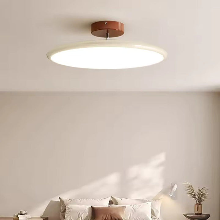 Adjustable LED ceiling lamp in a sleek modern design (green/beige) for targeted home lighting.