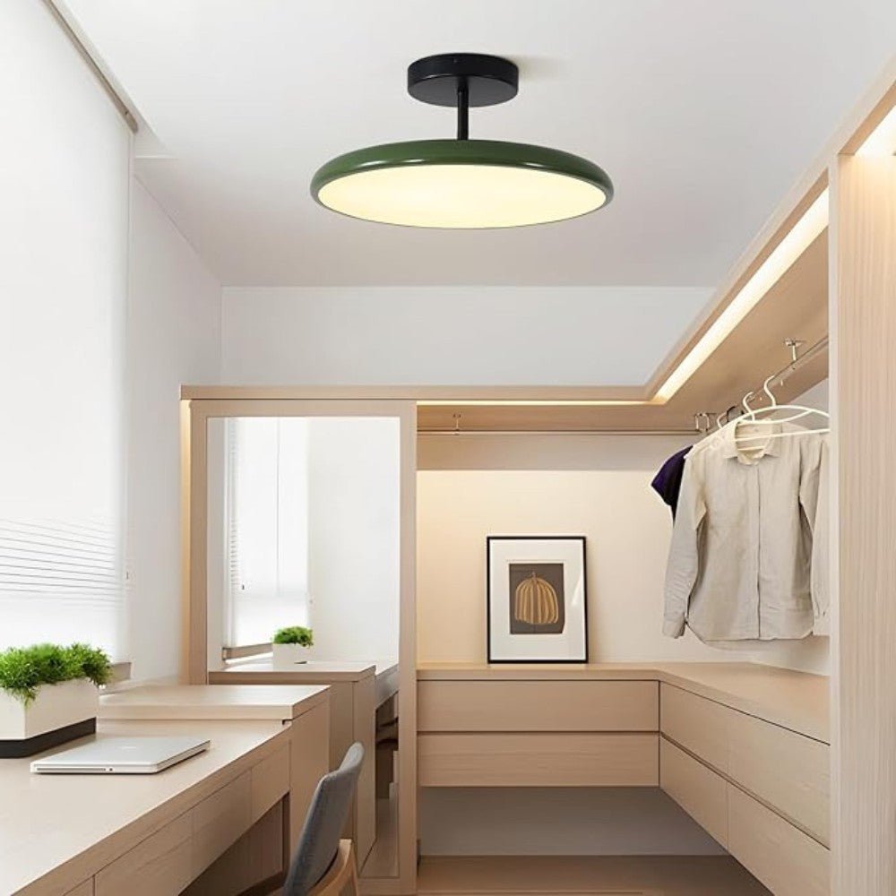 Sleek beige LED ceiling lamp, adjustable for directional home lighting and modern decor.
