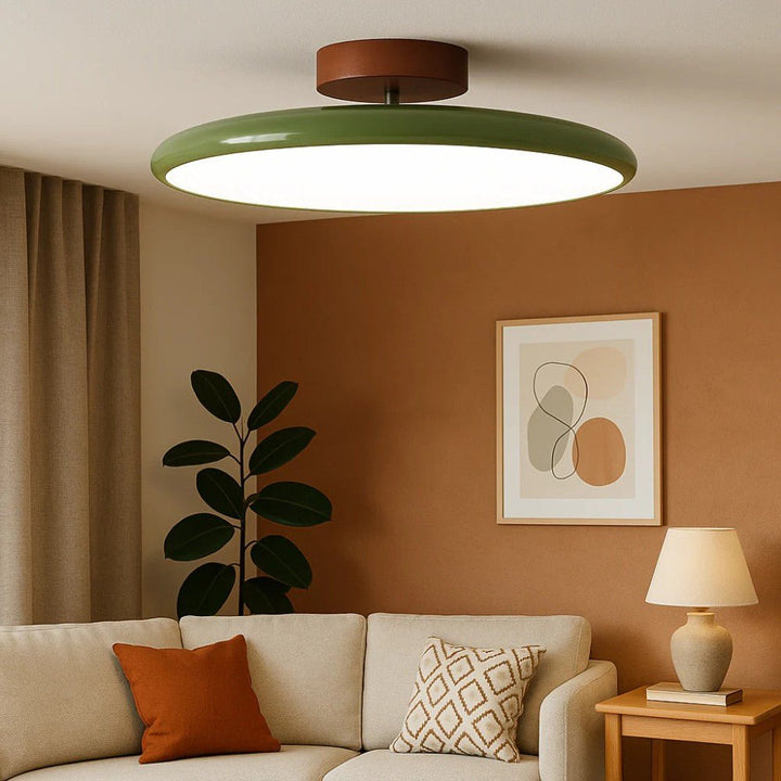 Modern adjustable LED ceiling light in green for targeted kitchen or bedroom lighting.