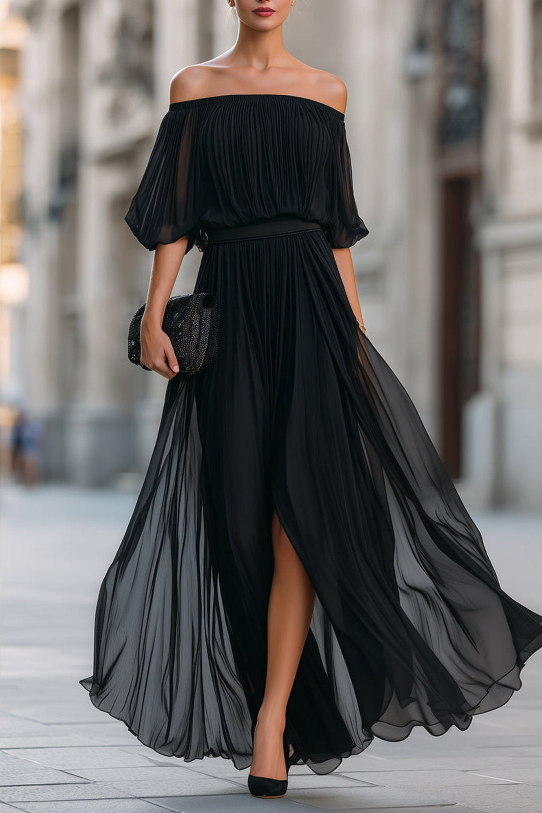 Full-length view of a woman wearing a flowing pleated off-shoulder formal maxi dress, elegant for events.