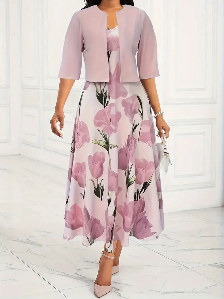 Women's pink floral maxi dress with matching cardigan, front view.