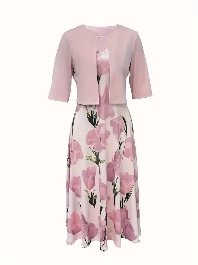 Close-up of the floral print on the women's pink maxi dress.