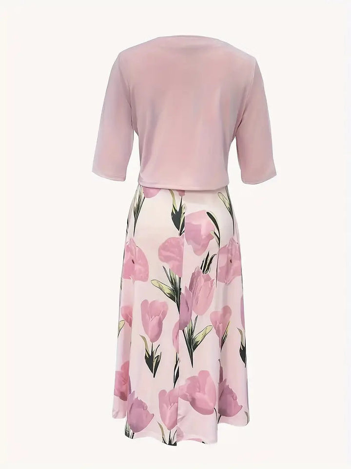 Women's pink floral maxi dress with 3/4 sleeve cardigan, side view.