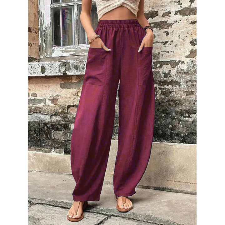 Back view of women's effortless wide-leg palazzo trousers, highlighting relaxed fit and elegant drape.