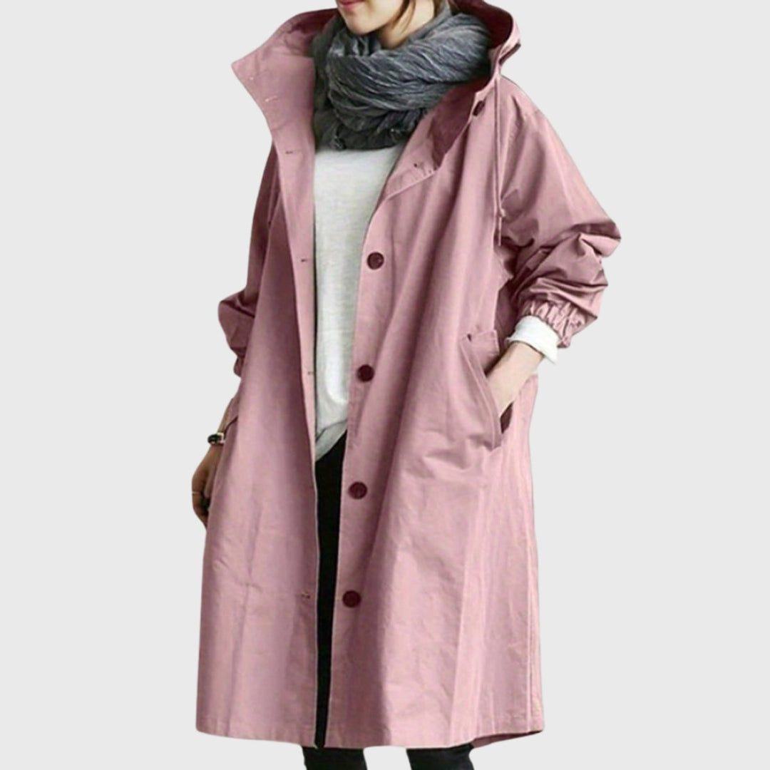 Full-length women's hooded trench coat, water-resistant for elegant travel & versatile fall fashion.