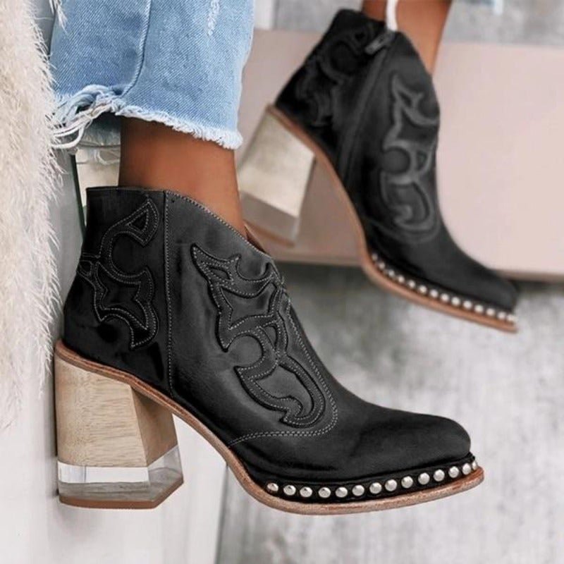Women's cowboy ankle boots with unique cut-outs and a comfortable block heel. Great for casual style.